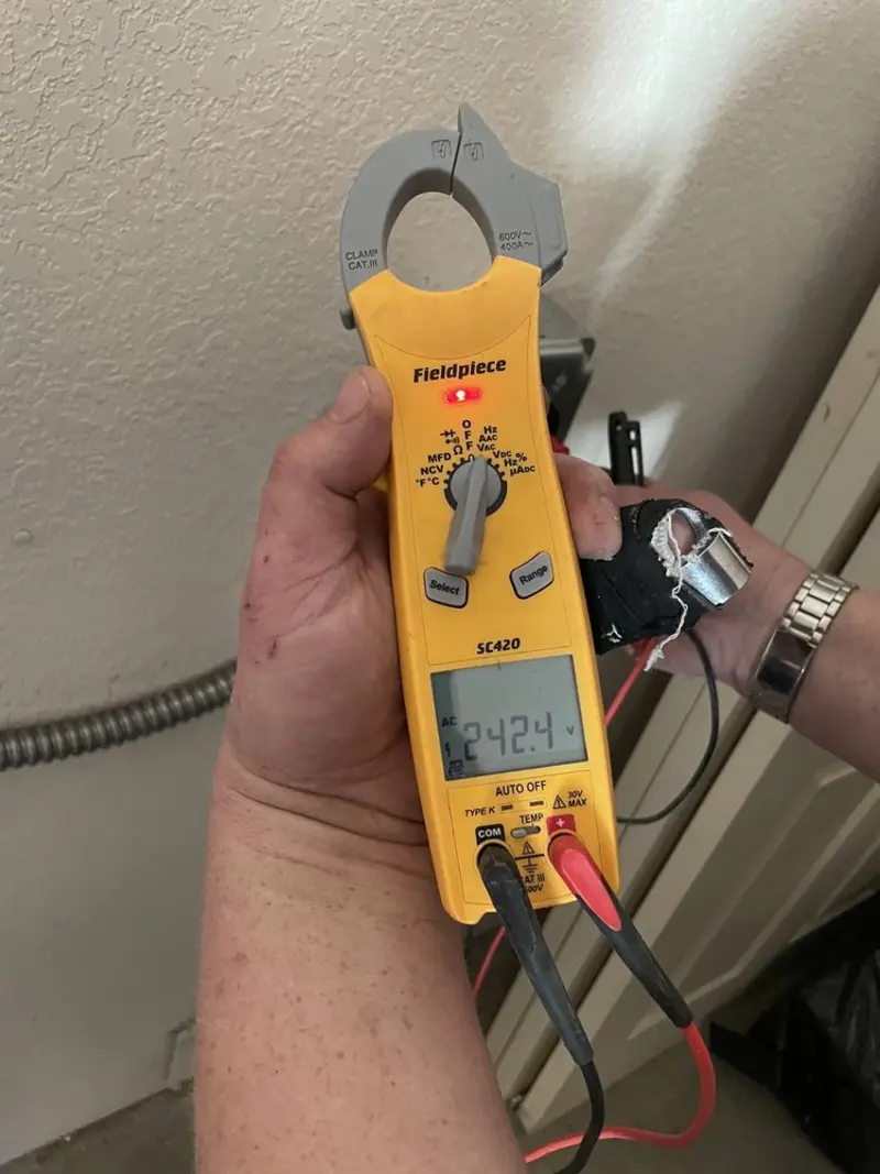 Voltage testing with clamp meter during Whole House Surge Protector in New Square